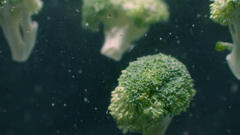 Green-fresh-broccoli-washed-in-clear-water-before-cooking-slow-motion